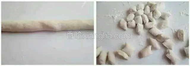 操作台上撒些木薯粉，芋艿面团取一小块，搓成细长条切小段，撒些木薯粉防粘连