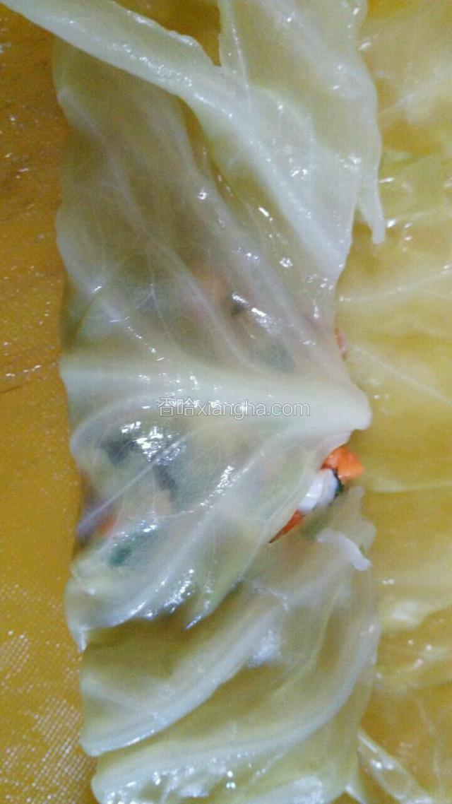 包起来两边往中间裹，像叠被子一样