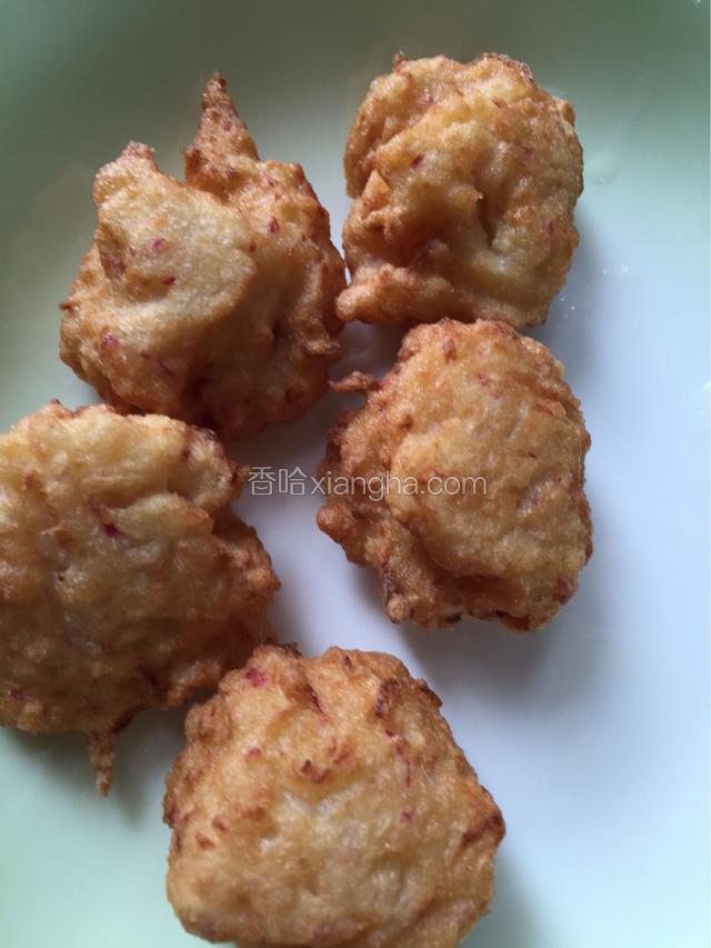 所有丸子炸好后再倒入油锅复炸一分钟即可
