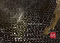 雪菜汁煮玉螺的做法图解3