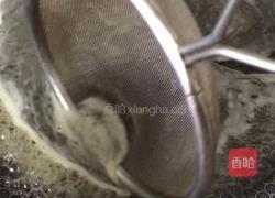 雪菜汁煮玉螺的做法图解5